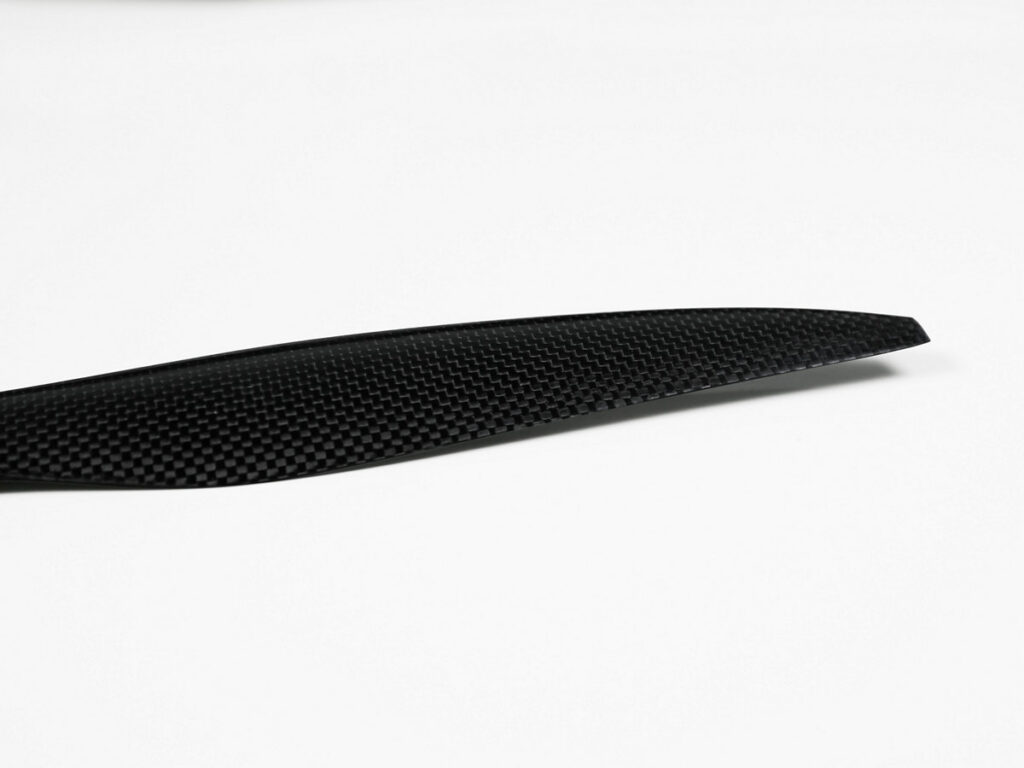 Close-up view of the black carbon fiber drone propeller (two-blade)